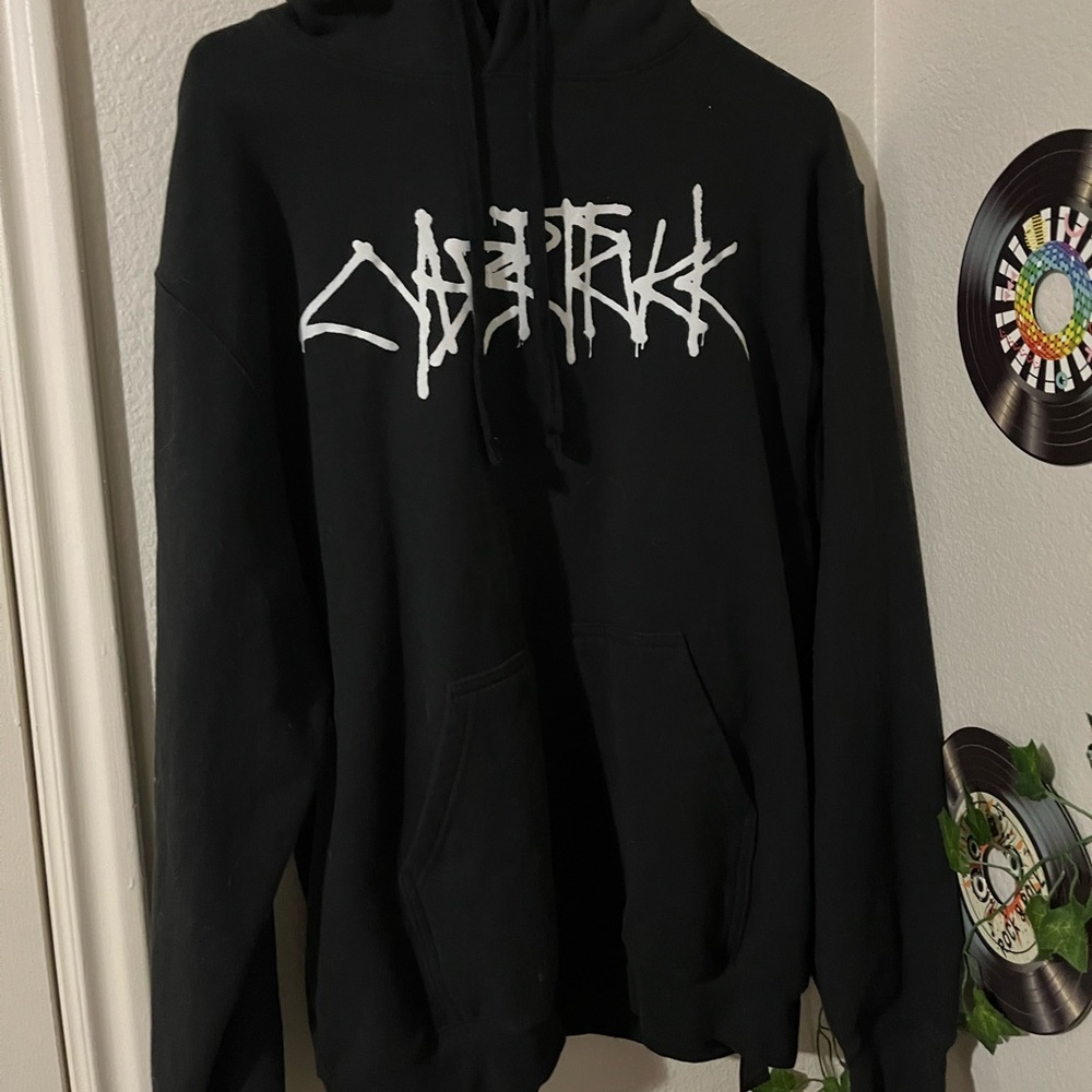 L black hoodie with riding not sure what it says